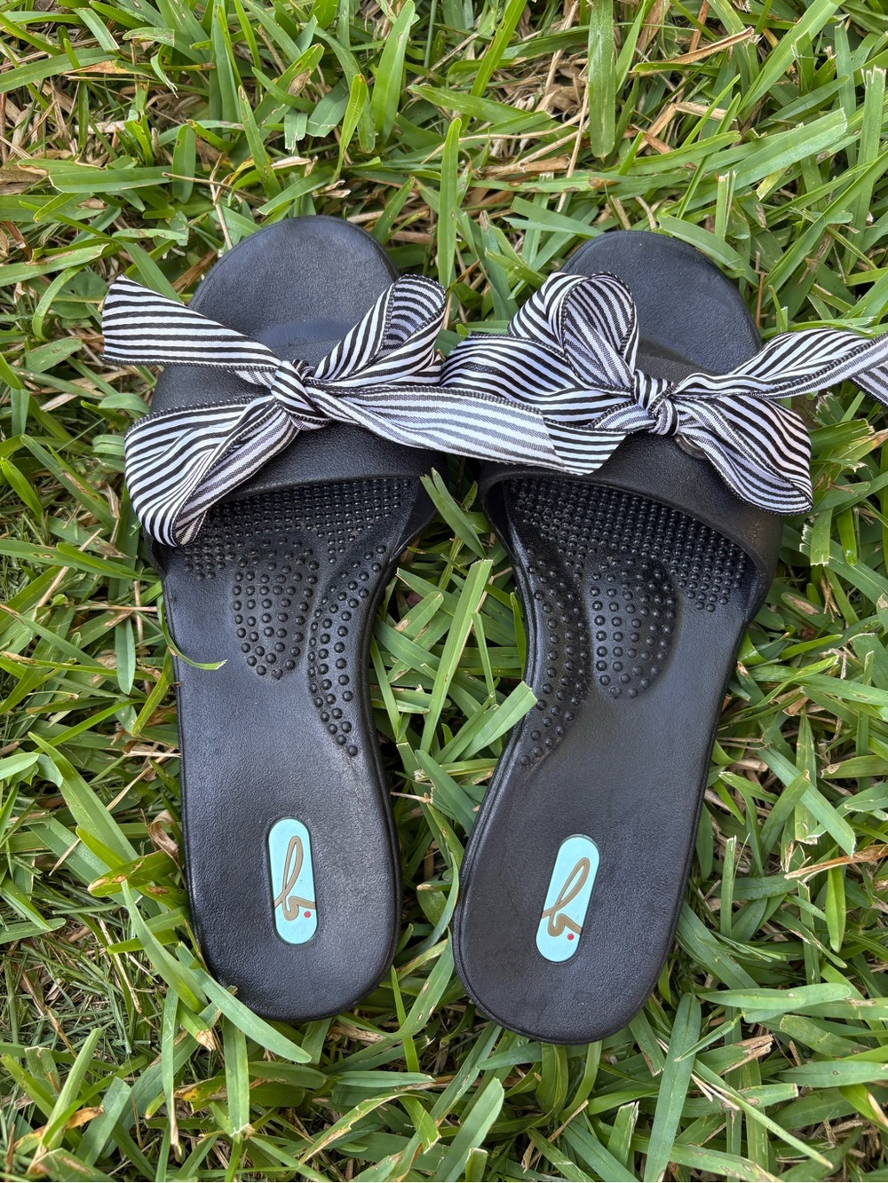 OKA b. Black Slide Sandals with Black-and-White Striped Bow